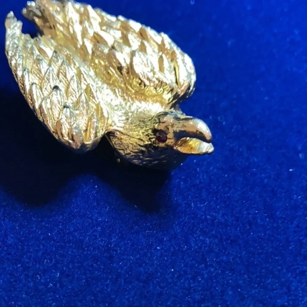 Vintage ‘60s gold tone Nesting eagle with red rhinestones